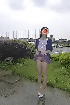 Asian girl having fun outdoors in a short skirt and a remote controlled vibrator